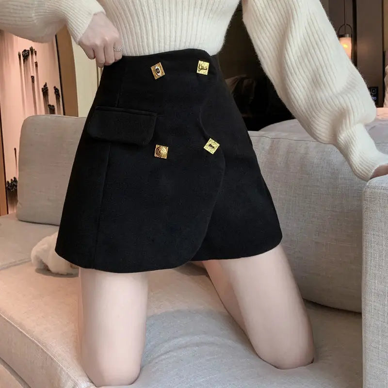 asymmetrical golden buttons shorts