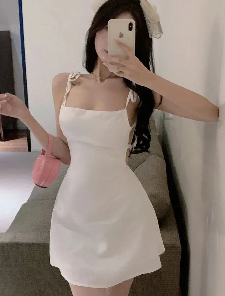 white sleeveless mini dresses