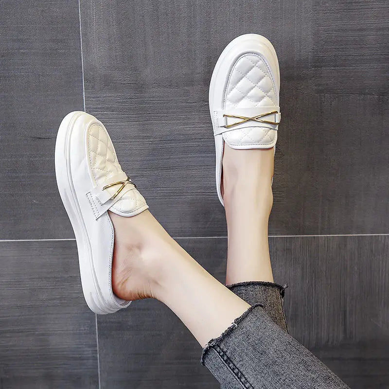 white flat leather slippers